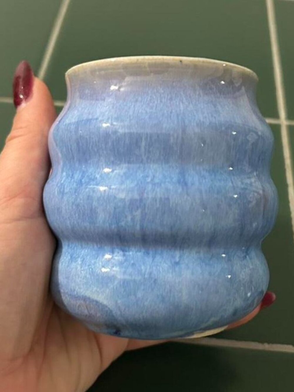 Blue ceramic tumbler / vase / pencil holder with a unique wavy design